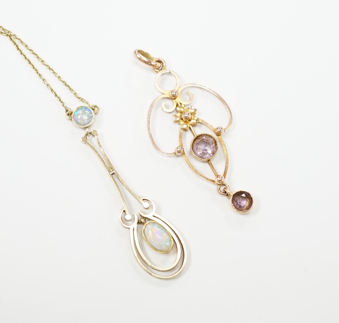 An Edwardian 15ct and two stone white opal set drop pendant necklace, chain unmarked, overall 46cm, and one other Edwardian 9ct and gem set pendant, 40mm.